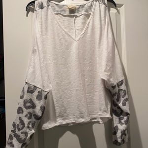 White open shoulder shirt with grey leopard print on sleeves